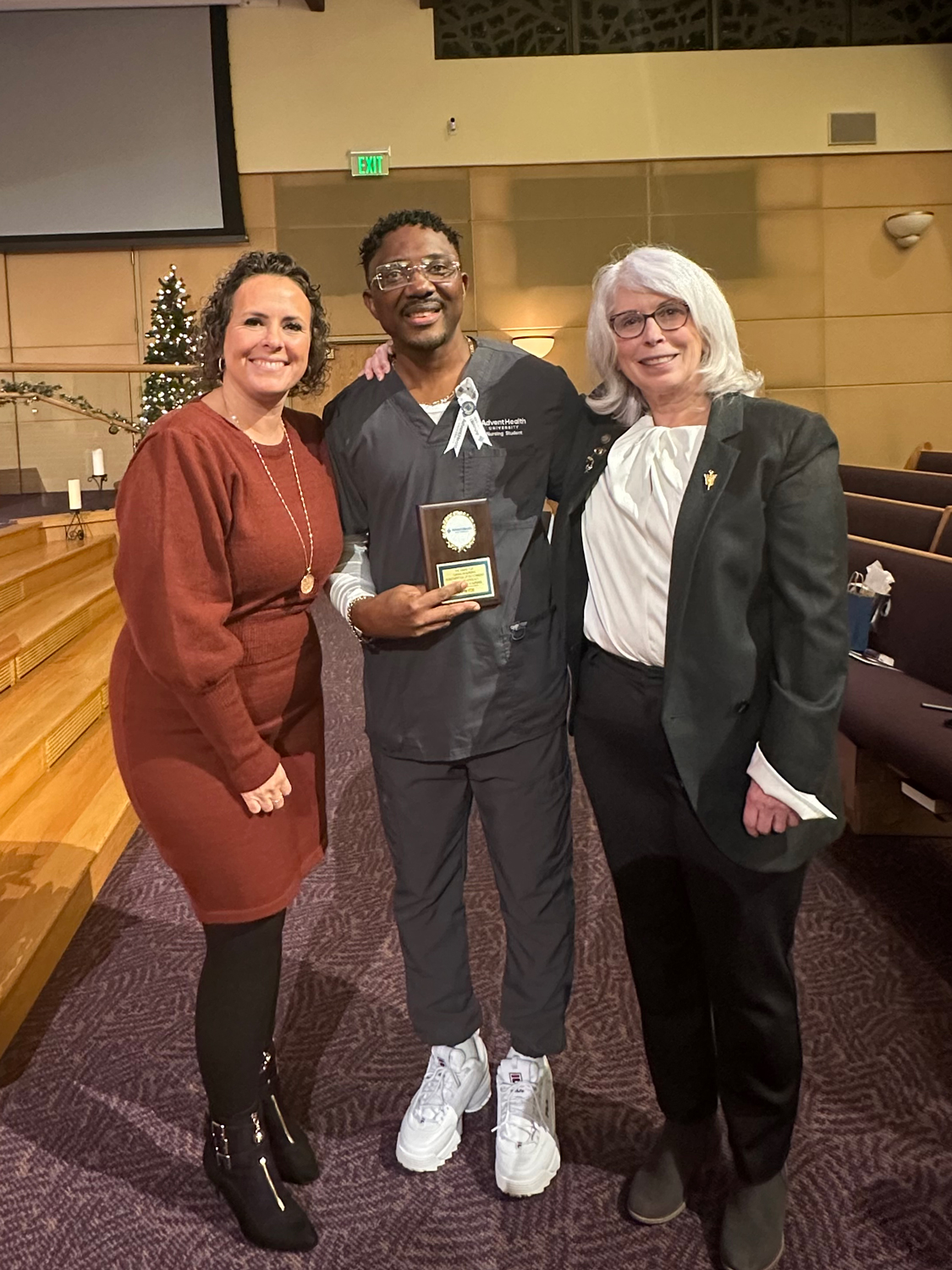 John Itoe with Nursing faculty members at the nursing pinning ceremony