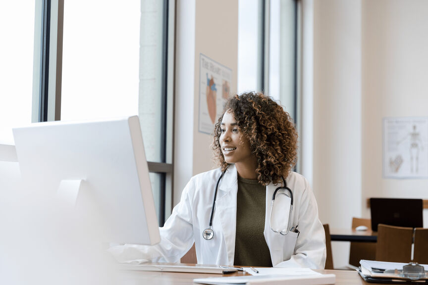 Female Physician using computer