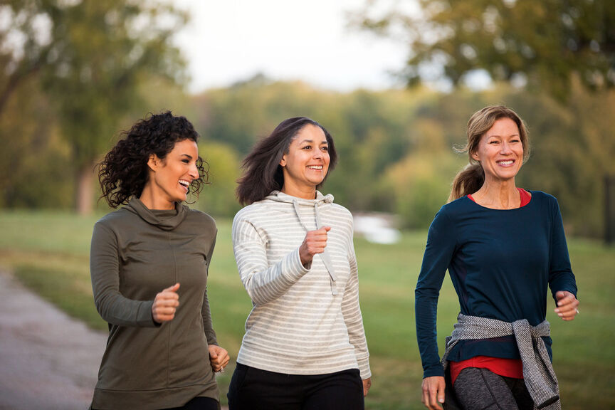 Three women walking in the park