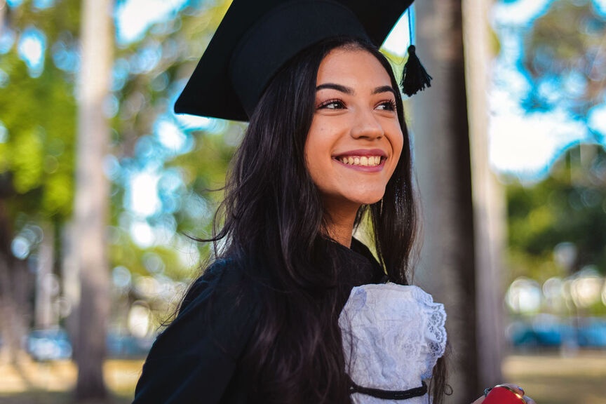 A female student in graduation regalia