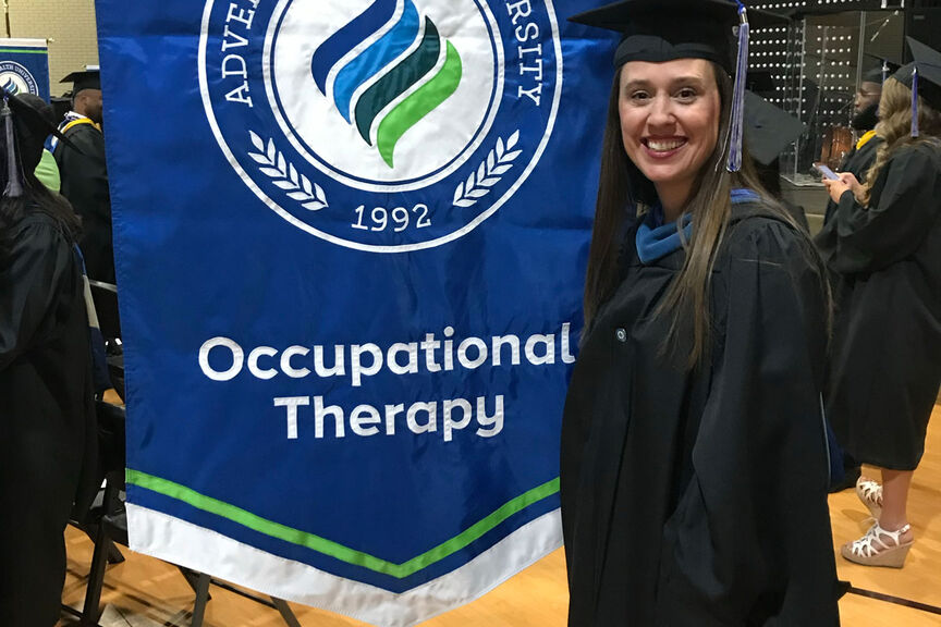 Image of Bryn Nadeau a graduate of the occupational therapy program in regalia.