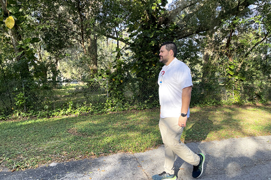 Kenny Torres Cruz walking outdoors