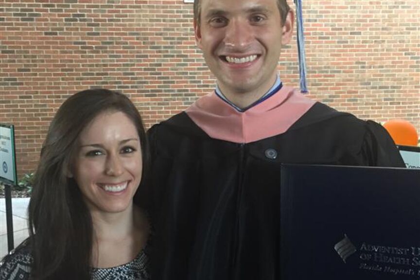 image of male graduate and woman smiling