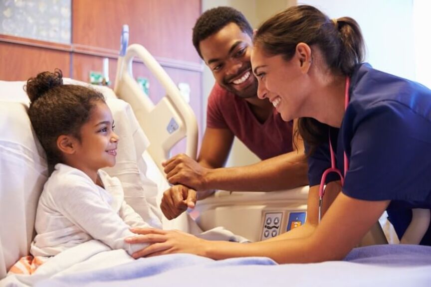 nurse-comforts-pediatric-patient