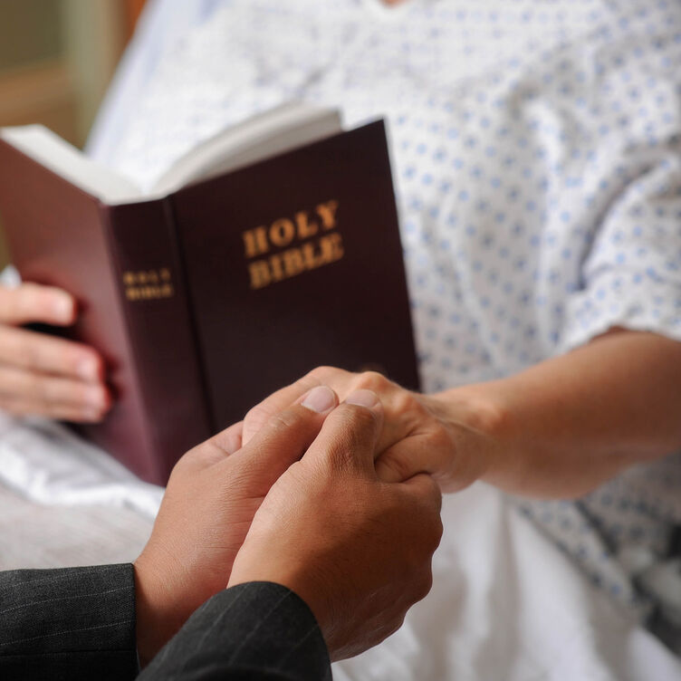 Chaplain with patient