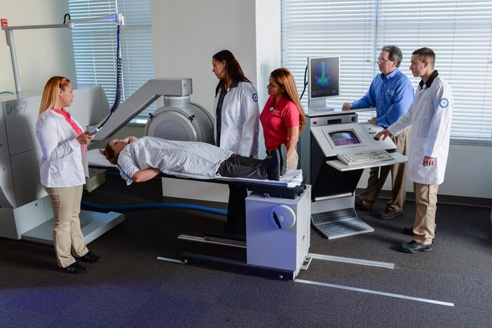 A group of people in a Nuclear Medicine Lab