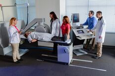 A group of people in a Nuclear Medicine Lab