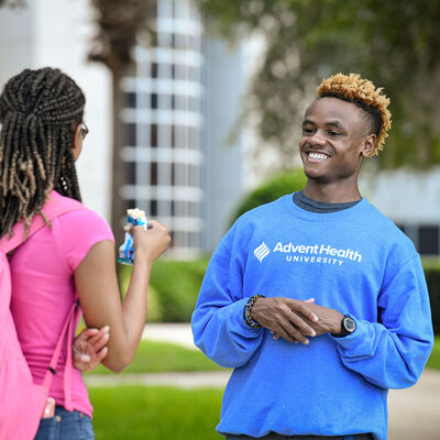 A student in an AHU sweater