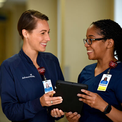 Two young female nurses working together in a hospital