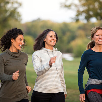Three women walking in the park