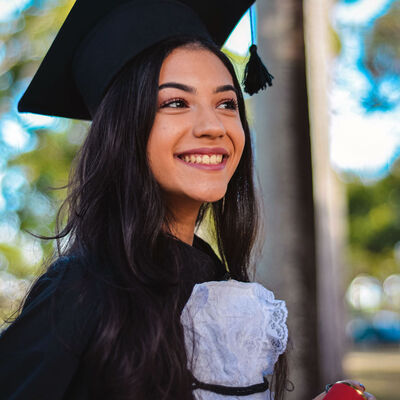 A female student in graduation regalia