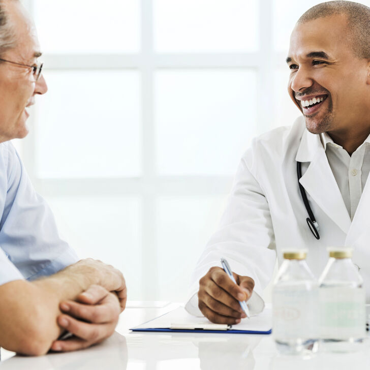 Older patient talking with doctor