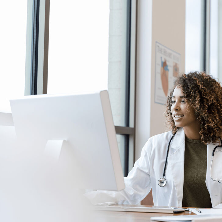 Female Physician using computer