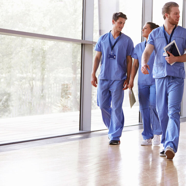 a group of nurses walking