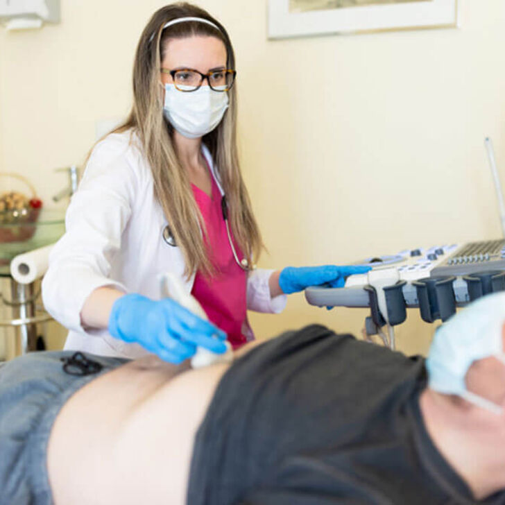 sonographer-examining-patient