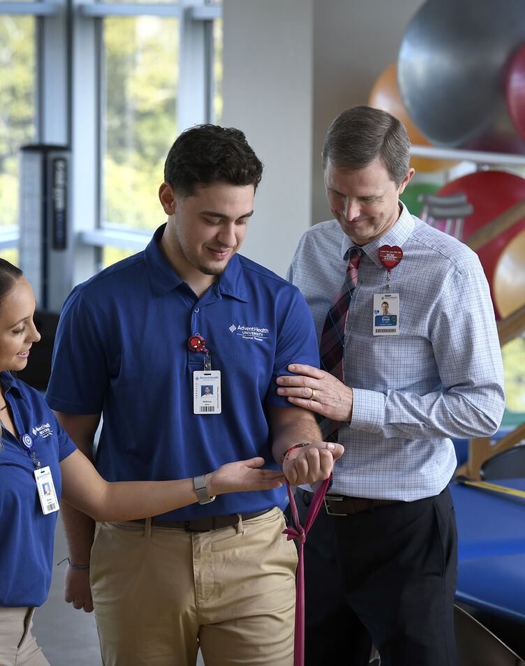 Physical Therapy students using an exercise band