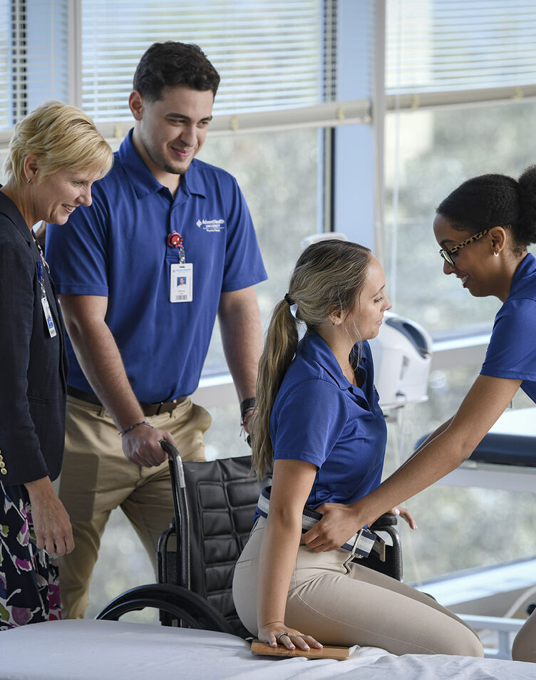 Physical Therapy students and professor demonstrating wheelchair use